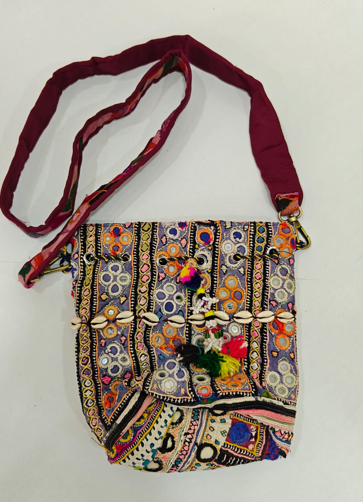Handcrafted Kutchi Mirror Work Sling Bag with Cowrie Shell Accents