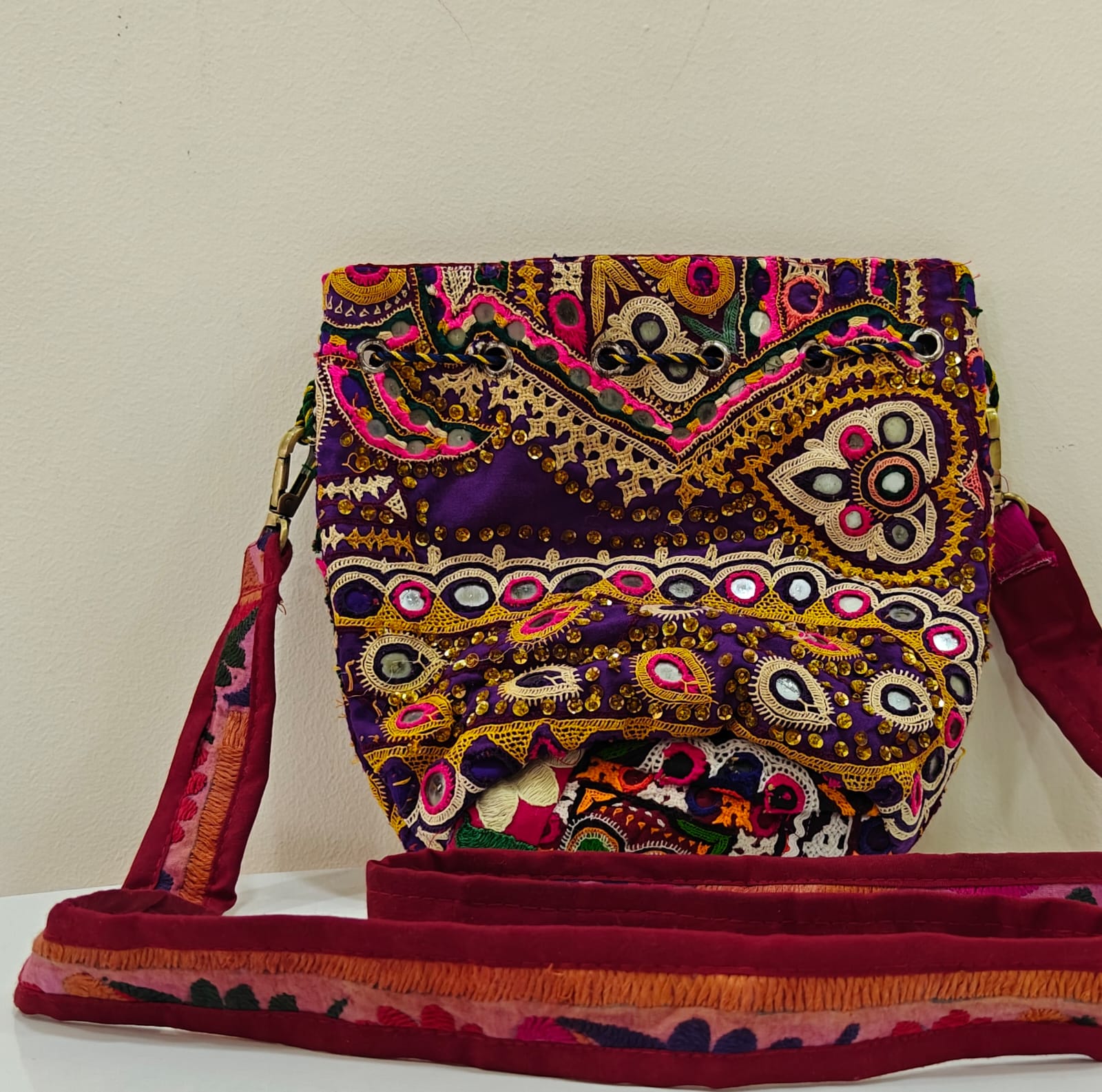 Handcrafted Kutchi Mirror Work Sling Bag with Cowrie Shell Accents