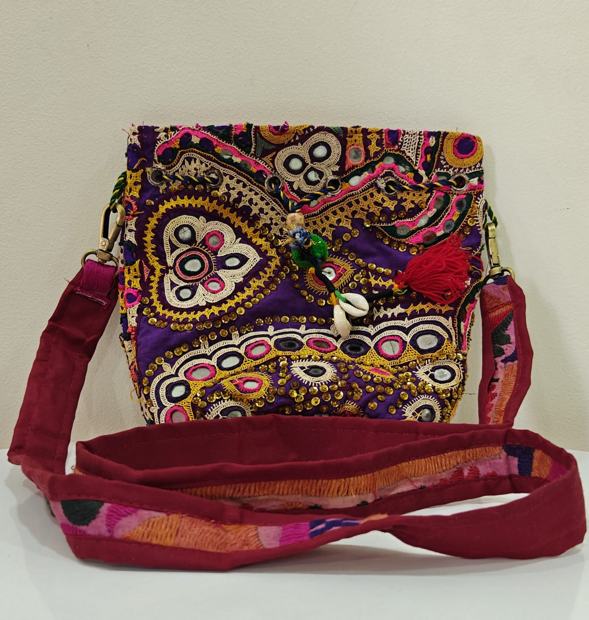 Handcrafted Kutchi Mirror Work Sling Bag with Cowrie Shell Accents