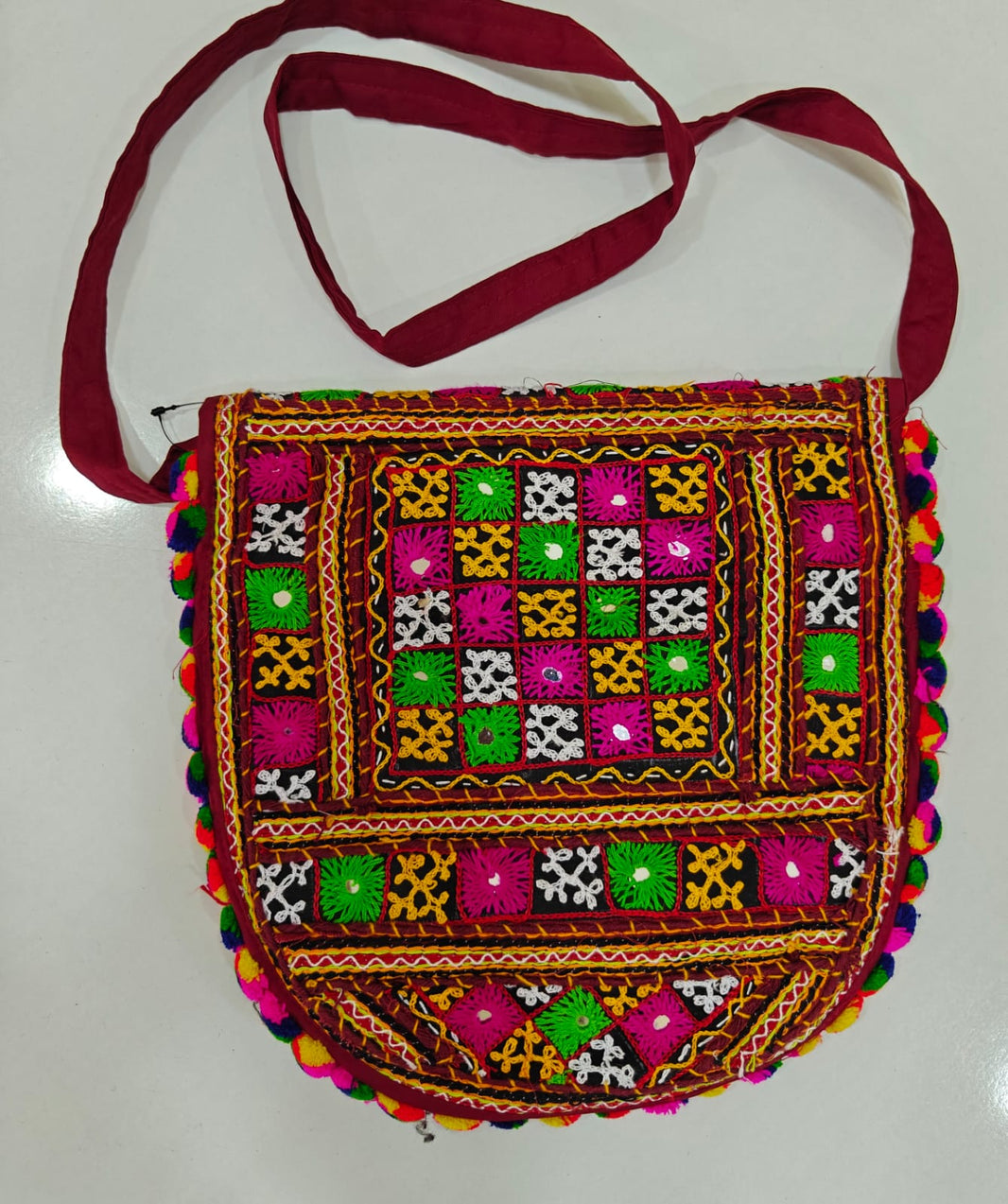 Handcrafted Kutchi Mirror Work D-Shape Sling Bag with Pom-Pom Accents