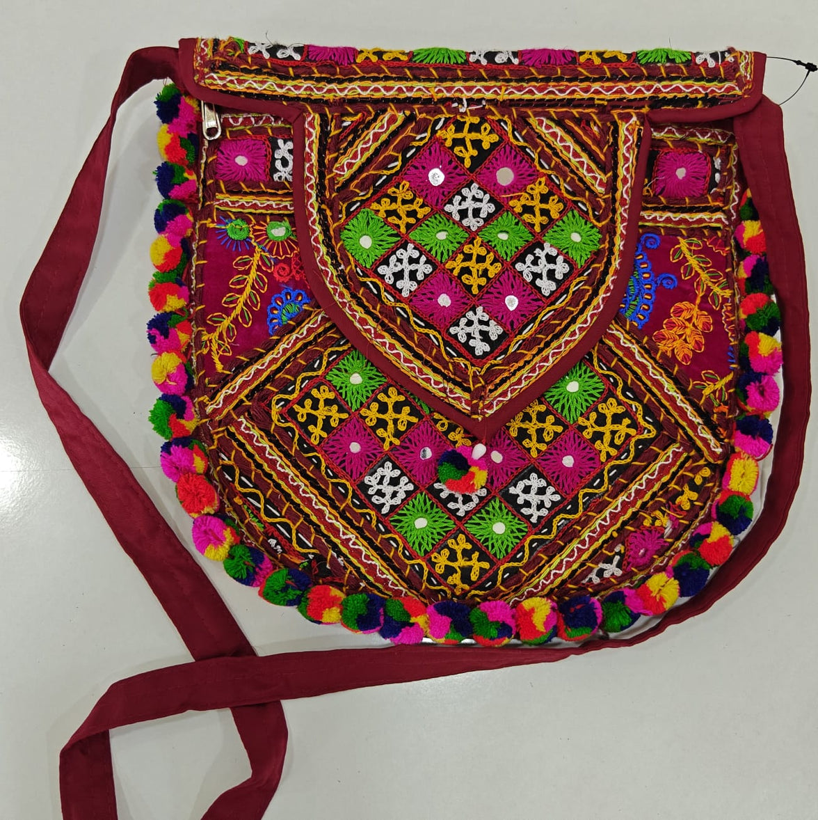 Handcrafted Kutchi Mirror Work D-Shape Sling Bag with Pom-Pom Accents