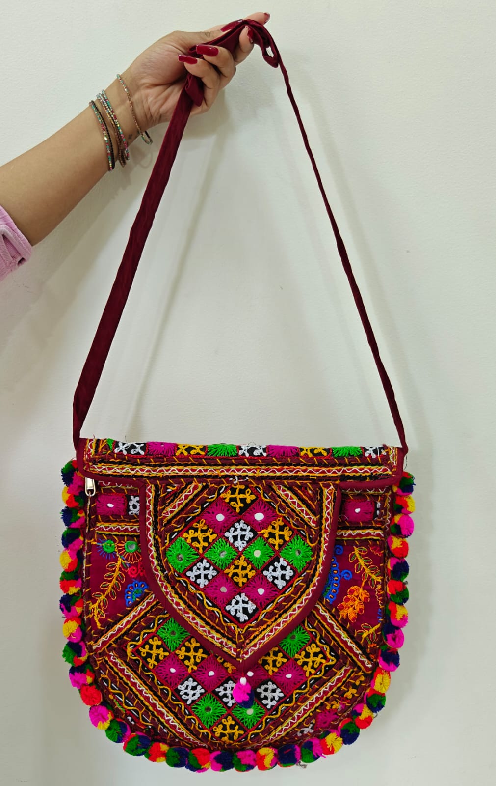 Handcrafted Kutchi Mirror Work D-Shape Sling Bag with Pom-Pom Accents