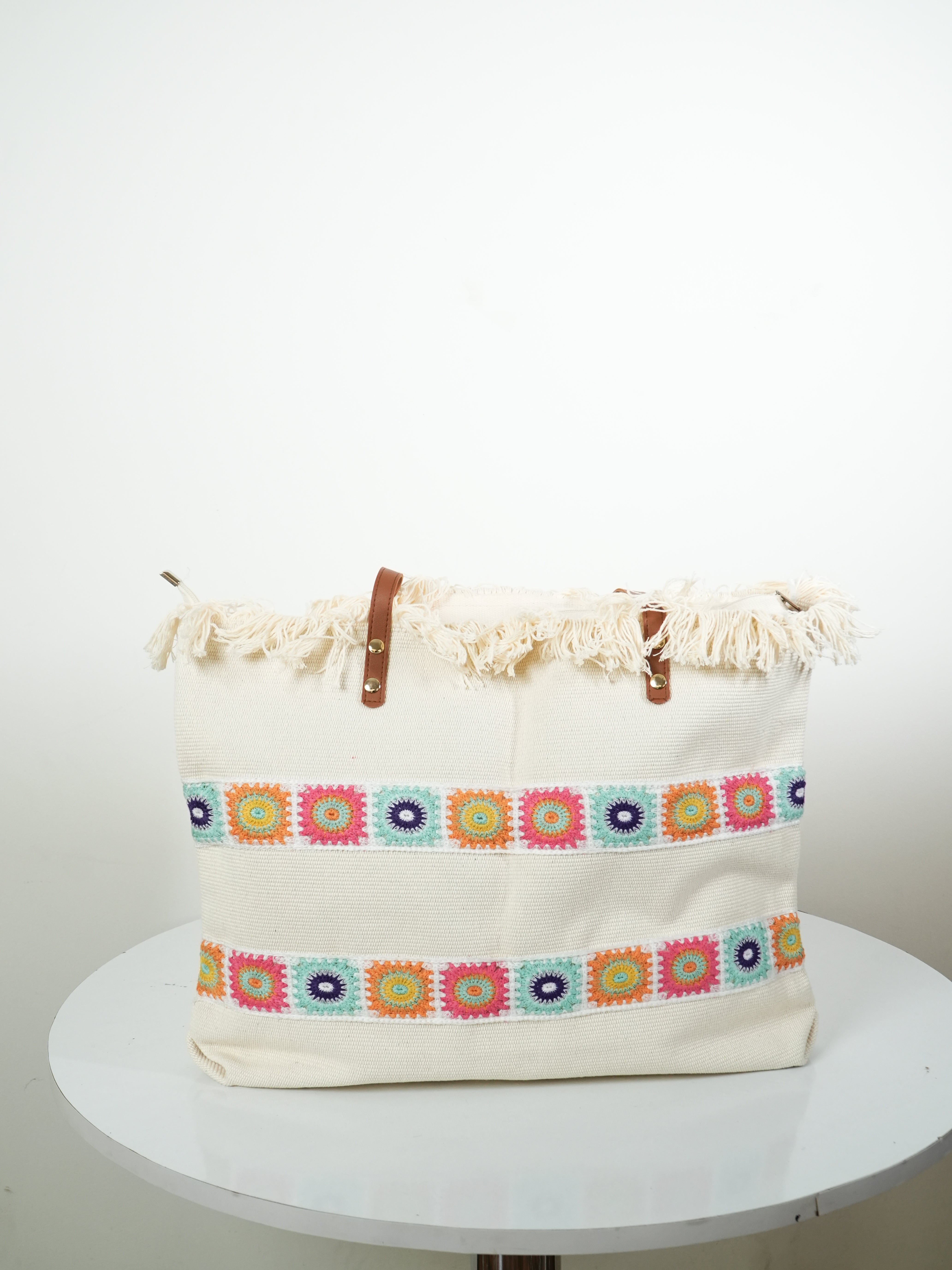 The Aabha  - cream-coloured handcrafted tote bag with colourful crochet detailing