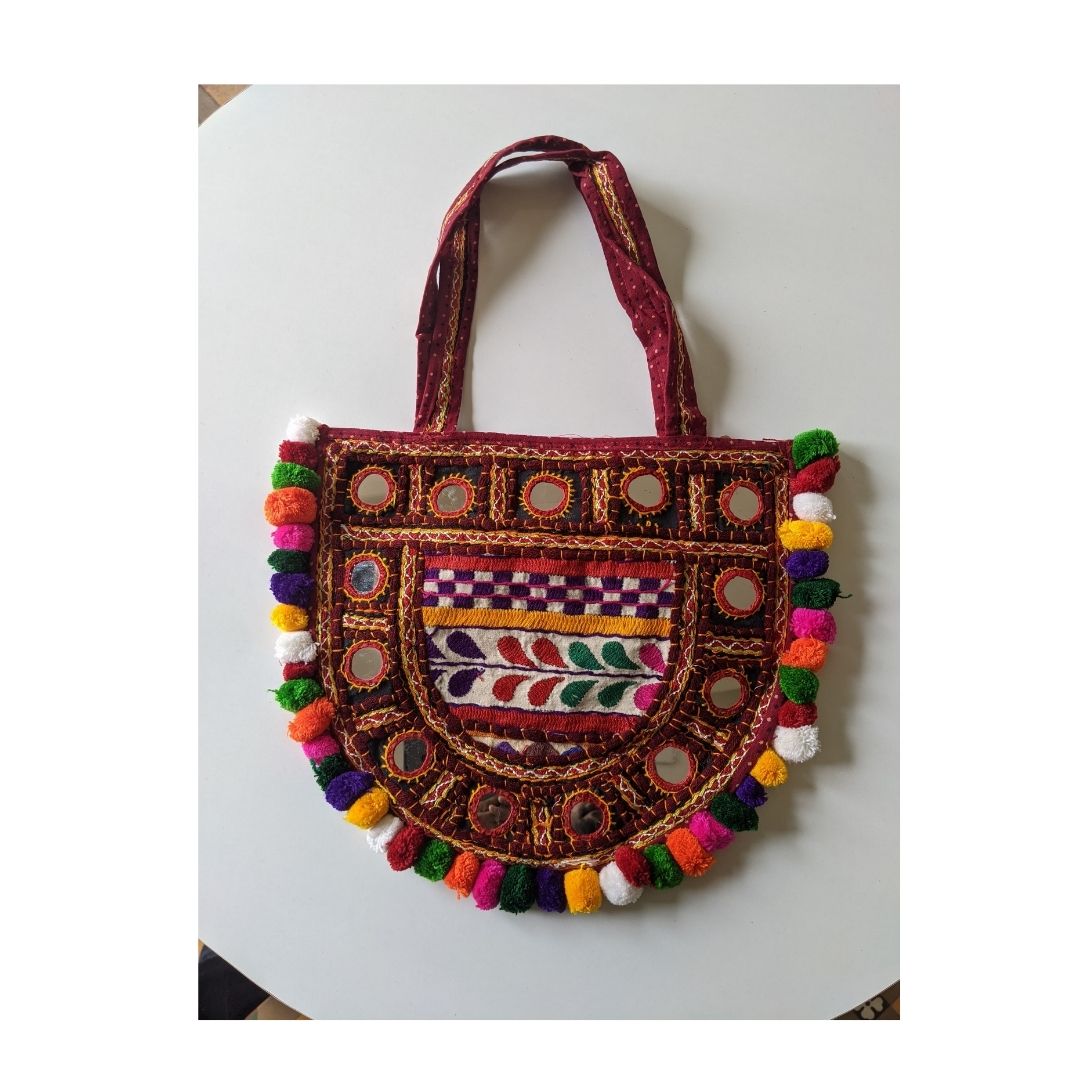 Handcrafted Kutchi Embroidered D-Shape Sling Bag with Mirror Work & Pom-Poms - Heritage Haat