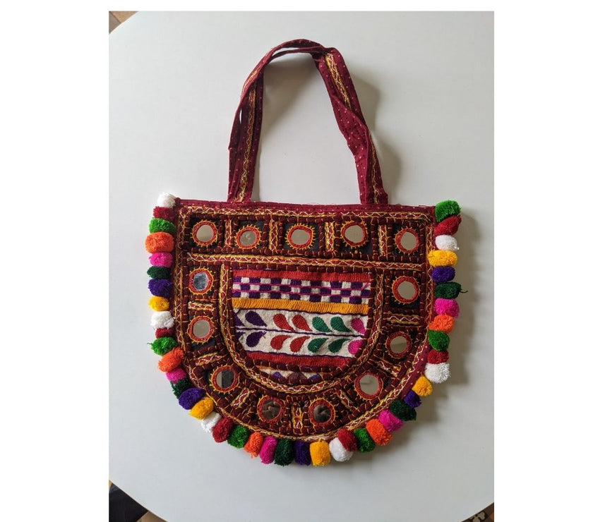 Handcrafted Kutchi Embroidered D-Shape Sling Bag with Mirror Work & Pom-Poms