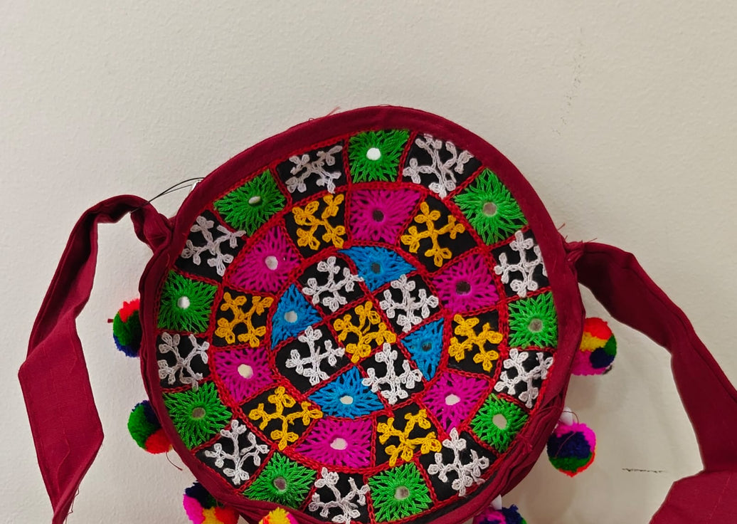 Handcrafted Kutchi Round Embroidered Sling Bag with Mirror Work & Pom-Poms