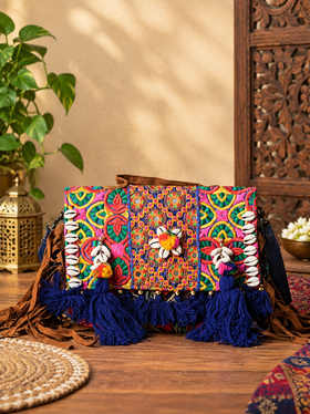 Handcrafted Banjara Patchwork Sling Bag with Mirror, Cowrie & Tassel Detailing